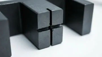 Precision machined rotary transformer core showing air gap measurement and alignment