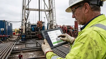 Oil and gas field worker using custom mobile data application