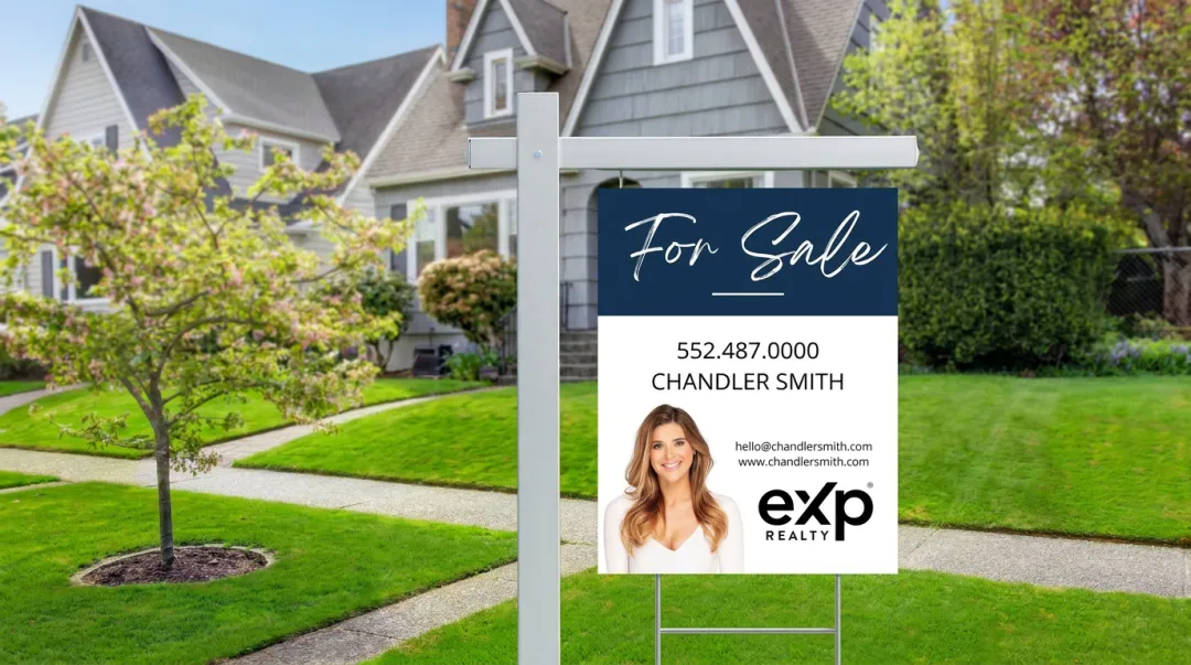 Real estate yard sign displayed on residential lawn with for sale branding