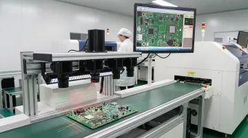 Automated optical inspection machine scanning assembled PCB surface for solder defects