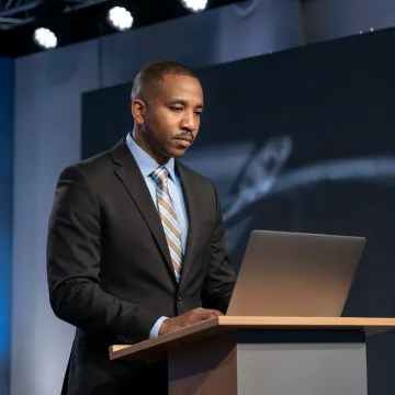 Speaker preparing a keynote presentation