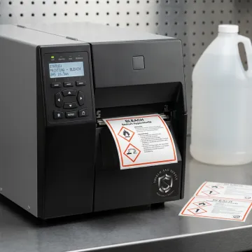 Industrial label printer producing bleach GHS labels