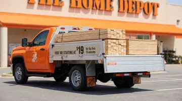 Home Depot flatbed F250 pickup truck loaded with lumber and building materials
