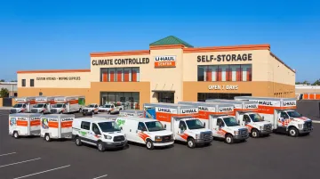 U-Haul corporate moving center exterior with trailers parked outside