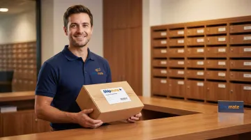 Staff member securely holding signed package at private mailbox center counter