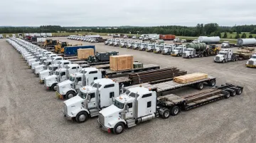 Sims Global Solutions heavy haul fleet with step deck trailers