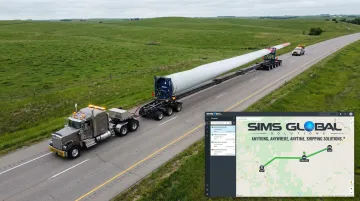 Heavy haul convoy transporting wind turbine blade with GPS fleet tracking