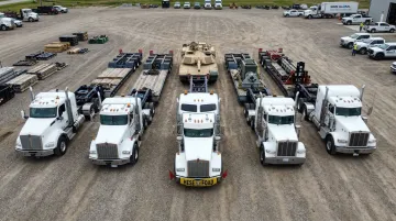 Sims Global heavy haul trucking fleet with RGN trailers and lowboys