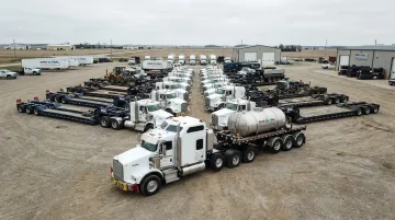 Sims Global Solutions heavy-haul fleet with RGN trailers and lowboys