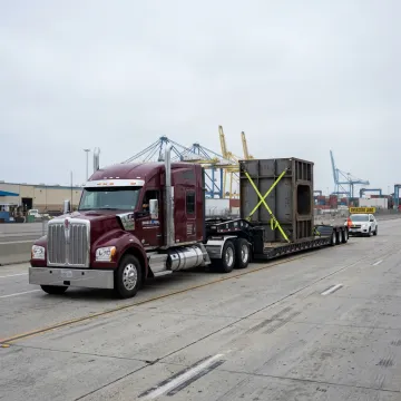 Heavy transport truck carrying oversized equipment in Long Beach