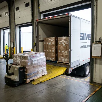 Temperature-controlled freight trailer at loading dock