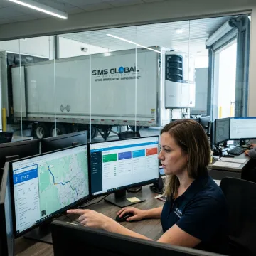 Logistics coordinator tracking refrigerated delivery shipment