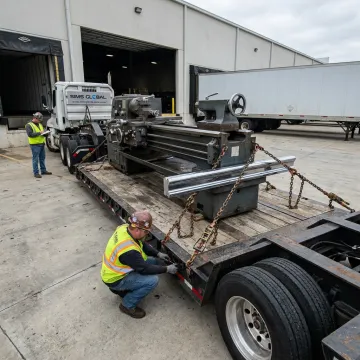 Heavy industrial lathe loaded on specialized trailer