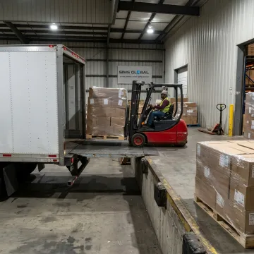 Palletized LTL freight loaded at a warehouse dock