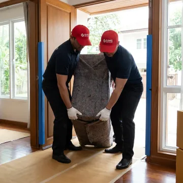 White-glove movers delivering custom furniture