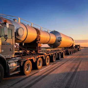 Heavy duty truck hauling oversized machinery