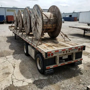 Cable reels loaded on a specialized freight trailer