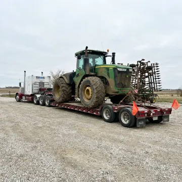 Agricultural equipment loaded for hauling