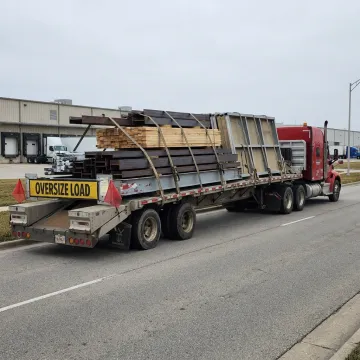 Flatbed truck hauling construction materials in Illinois