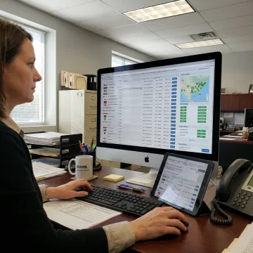 Logistics coordinator managing LTL freight tracking