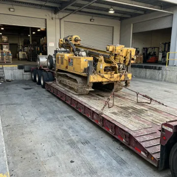 Heavy machinery loaded on specialized trailer