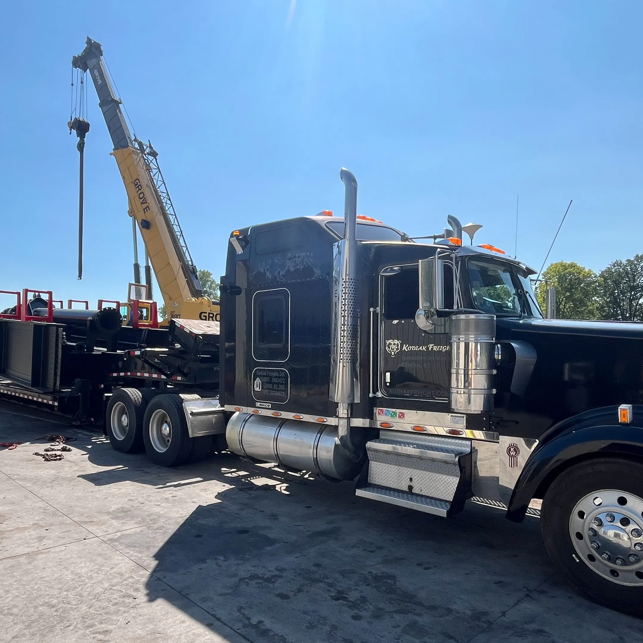 Crane lifting heavy industrial equipment