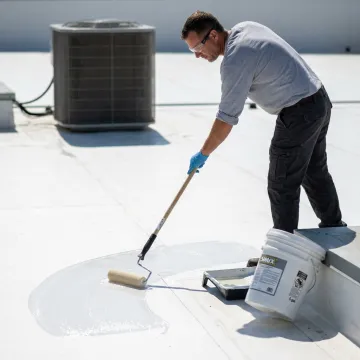 White roof being cleaned and coated