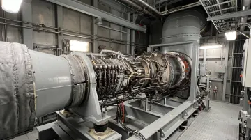 GE LM2500 marine gas turbine engine installed in naval vessel engine room