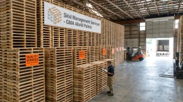 Stacked GMA 48x40 four-way entry wood pallets ready for FBA shipment