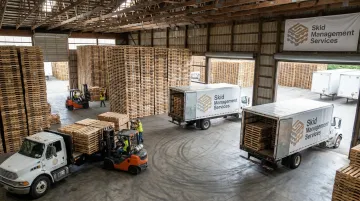Skid Management Services warehouse yard supporting pallet supply and pickup lifecycle