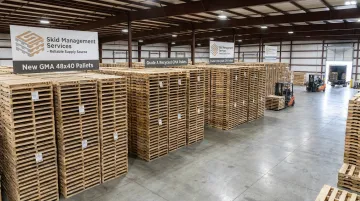 Stacked new and recycled GMA pallets ready for warehouse distribution
