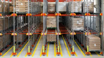 Organized warehouse pallet storage area with racks clear aisles and stacked pallets