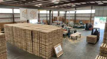 Pallet manufacturing facility producing consistent standardized wooden pallets stock