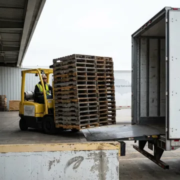 Pallet pickup process at an industrial facility
