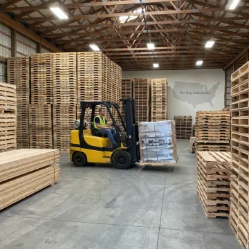 Custom wood pallets stacked in a warehouse