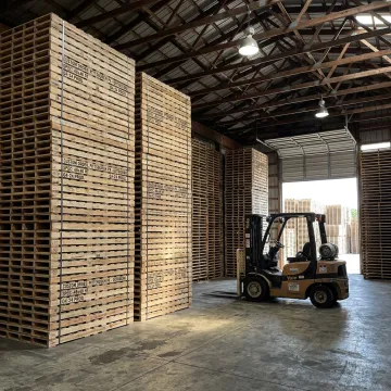 Custom wood pallets stacked in a warehouse