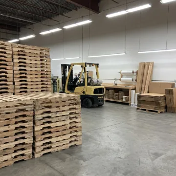 Custom wood pallets stacked in a warehouse