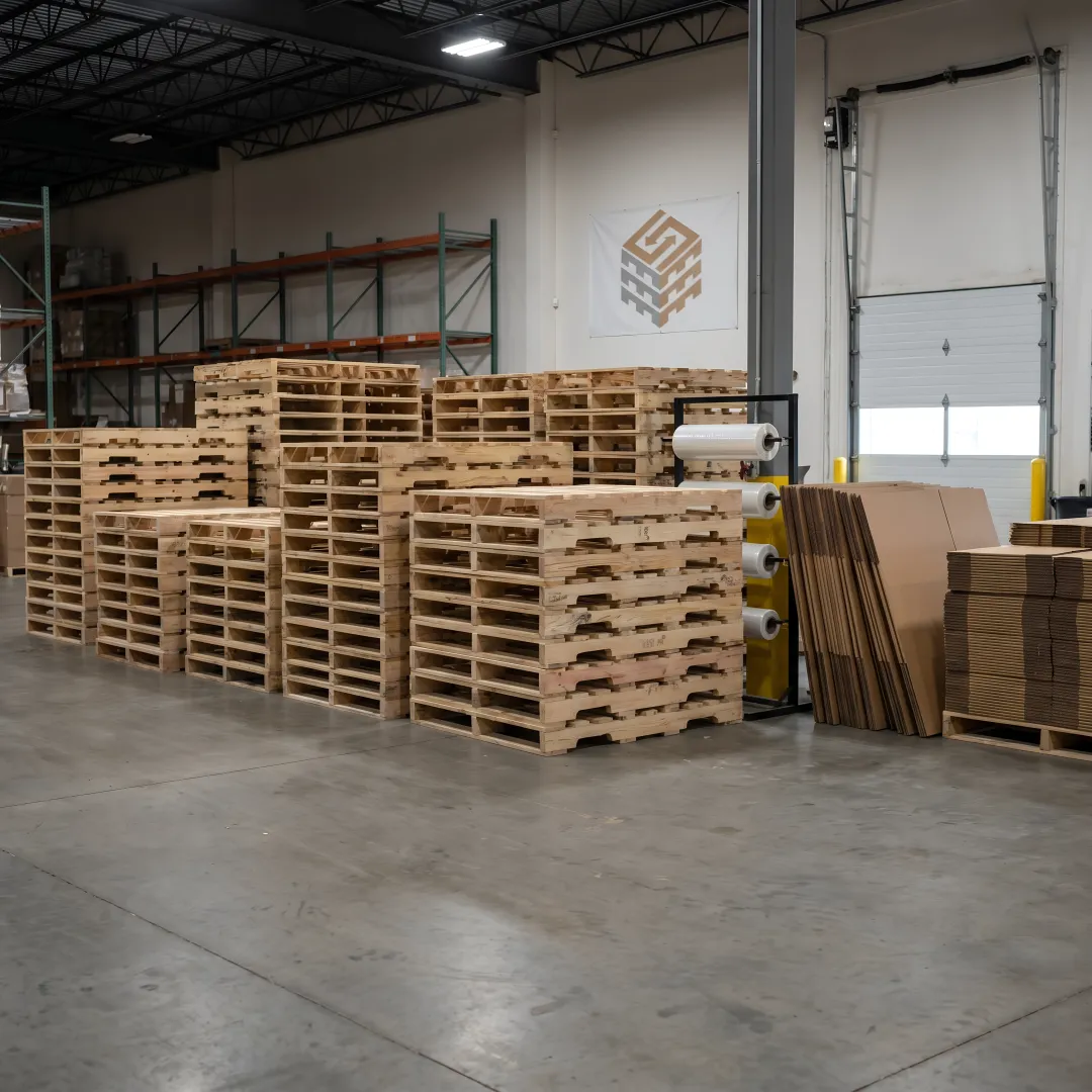 Custom wood pallets stacked in a warehouse