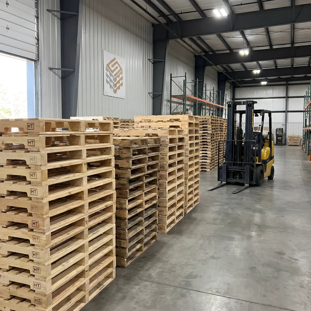 Custom wood pallets stacked in a warehouse