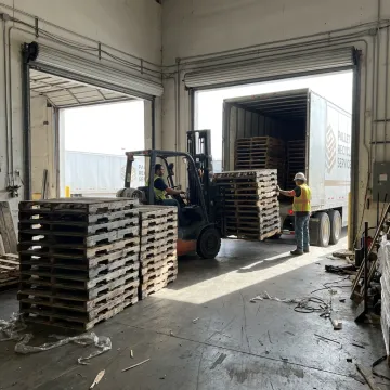 Pallet removal service at warehouse dock
