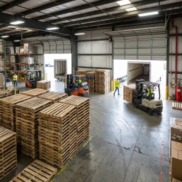 Recycled pallets in a logistics warehouse