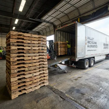 Pallet collection truck at warehouse dock