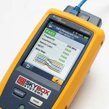 Network certification test results displayed on professional testing equipment