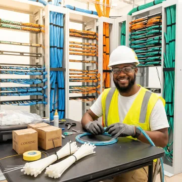 Fiber optic cable installation technician working on network infrastructure in Jacksonville