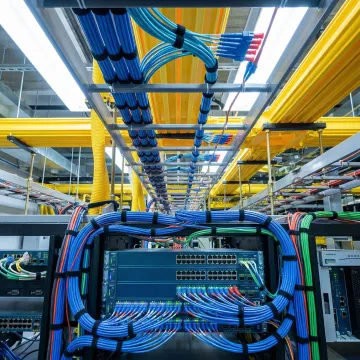 Enterprise network infrastructure with fiber optic cables and networking equipment in modern data center