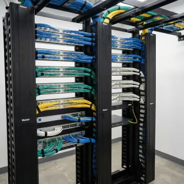 Organized Panduit network infrastructure with color-coded cabling system