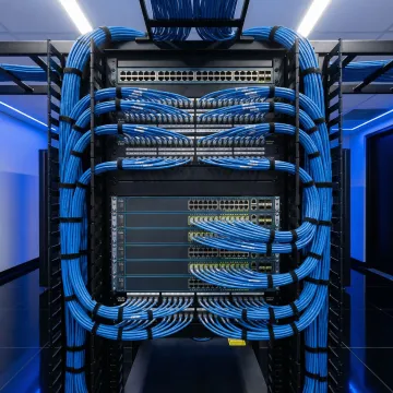 Organized network rack with labeled cables and equipment in Atlanta office