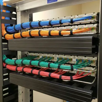 Organized network cabling infrastructure with labeled cables and patch panels