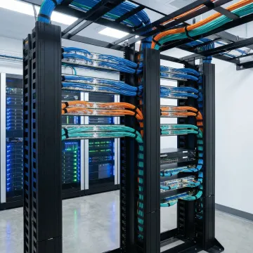 Modern enterprise data center with organized cable management and network racks