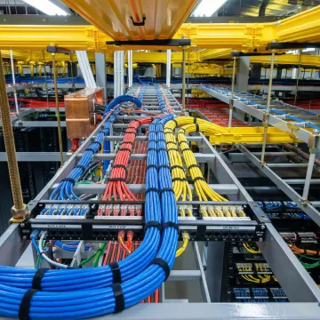 Organized network server rack with labeled cables and professional cable management